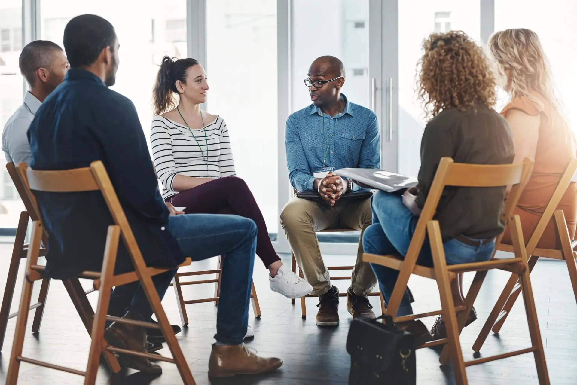 A supportive group sitting in a circle of chairs